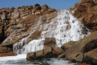 foam on the rocks at the Point's tidal pool in Mossel Bay